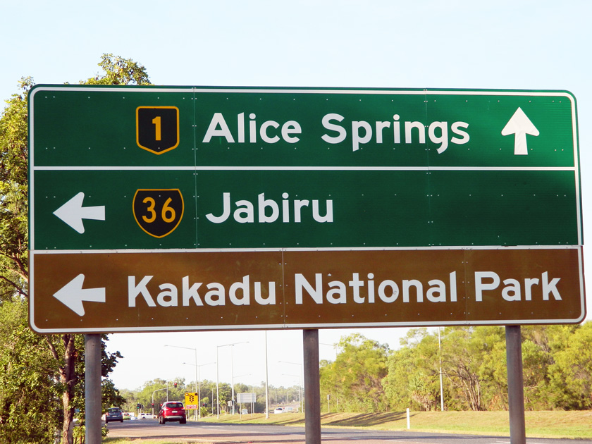 Brown tourist attraction road signs in the Northern Territory