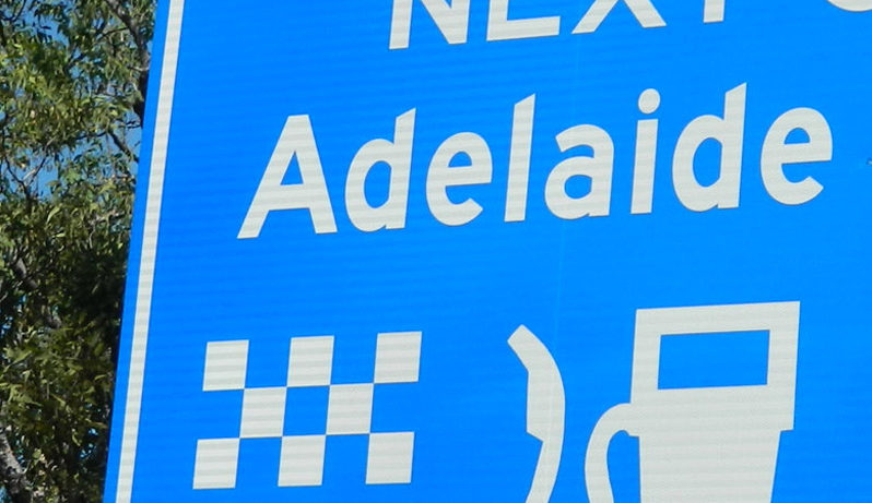 Blue services advance warning sign incorporating Australian Standard services symbols